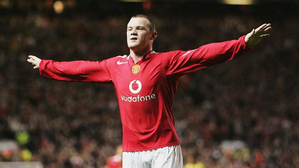 Wayne Rooney celebrates on his Manchester United debut after a deadline day move